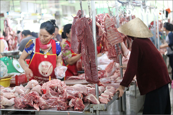 A kiosk selling pork meat at a local market.