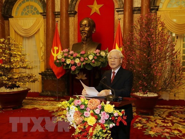 Party General Secretary and President Nguyen Phu Trong offers Tet greetings at the get-together in Ha Noi on 1 February.