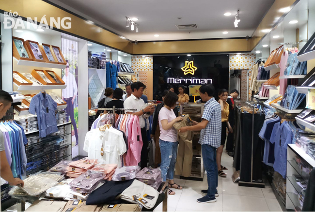 Shoppers at a Merriman fashionable clothing shop