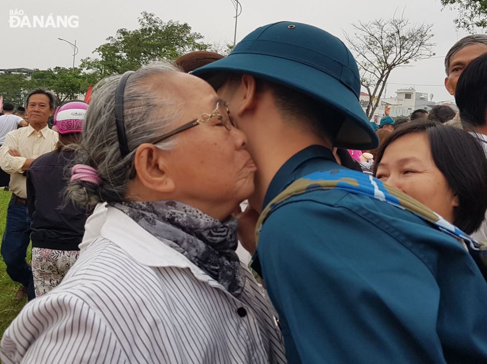 A soldier saying goodbye to his grandmother.