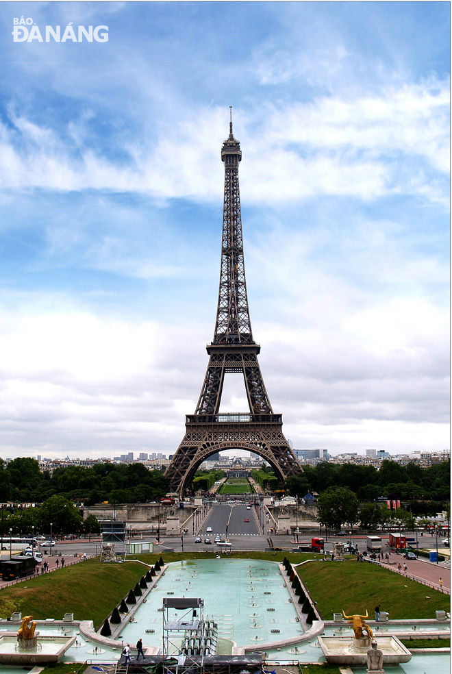 The wrought-iron lattice Eiffel Tower in the Champ de Mars in Paris, France