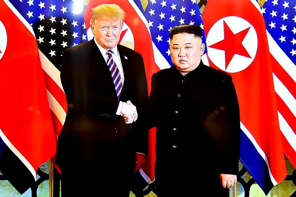 US President Donald Trump (L) and leader of the Democratic People’s Republic of Korea Kim Jong-un at their one-on-one meeting in Hanoi on February 27