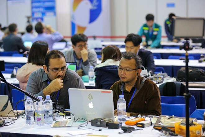 Foreign reporters are working at the International Media Centre (Source: VNA)