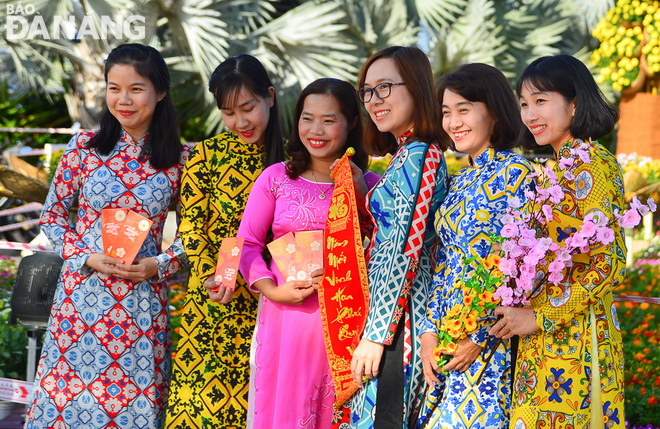 Local women in ‘ao dai’ (Vietnamese traditional long dress)
