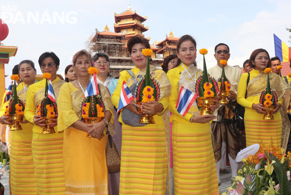  A Thai Buddhist delegation in traditional costumes at the festival