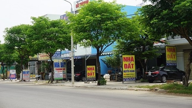 Real estate agents seen on a street in Da Nang
