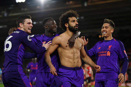 Salah cởi áo chia vui bàn thắng giúp Liverpool ngược dòng thành công. Ảnh: AFP.