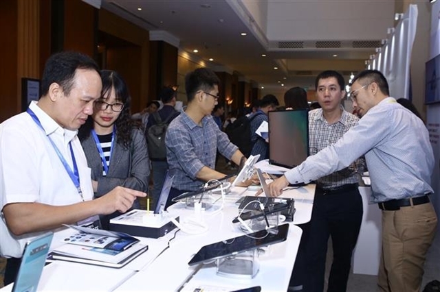 Representatives of businesses visit an exhibition on technological products as part of the conference on cybersecurity. — VNA/VNS Photo Minh Quyết Read more at http://vietnamnews.vn/sports/518824/viet-nam-to-improve-cyber-security.html#gmTuvxgUcUZWpFQ1.99