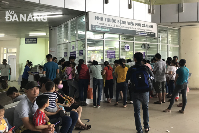 Parents with their children waiting for getting medicines ….