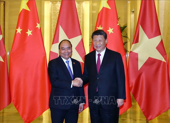 Thủ tướng Nguyễn Xuân Phúc hội kiến Tổng Bí thư, Chủ tịch Trung Quốc Tập Cận Bình. Ảnh: Thống Nhất/TTXVN