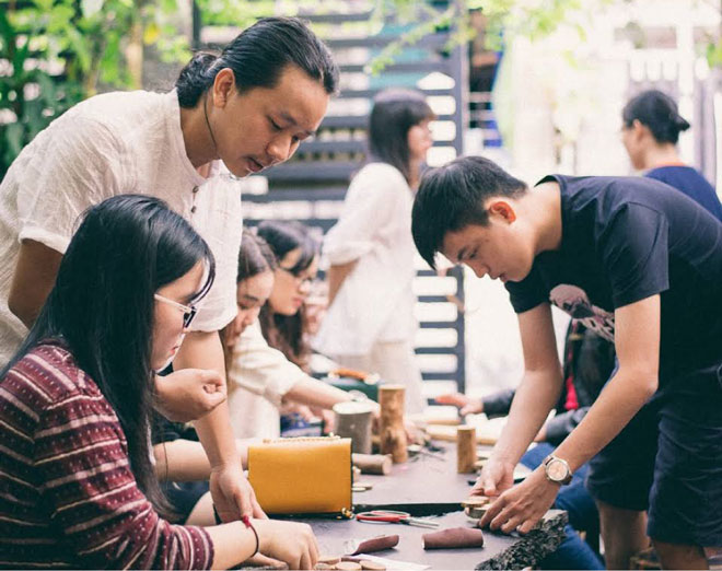 Visitors making wooden products at the An Nhien Farm