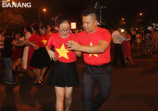 Dancers being dressed in red and yellow, the colours of Viet Nam’s national flag