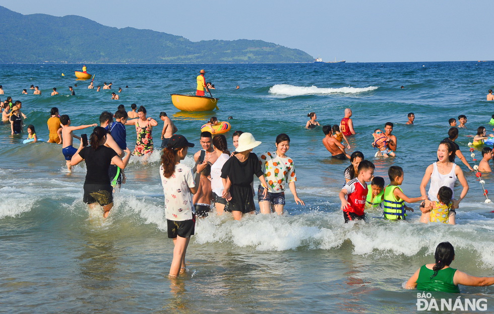  The fun and boisterous atmosphere being seen on a local beach filled with swimmers