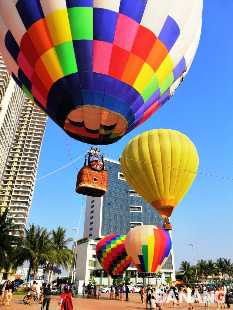 The city’s sky being beautifully dotted with eye-catching rainbow-coloured hot air balloons in the early morning