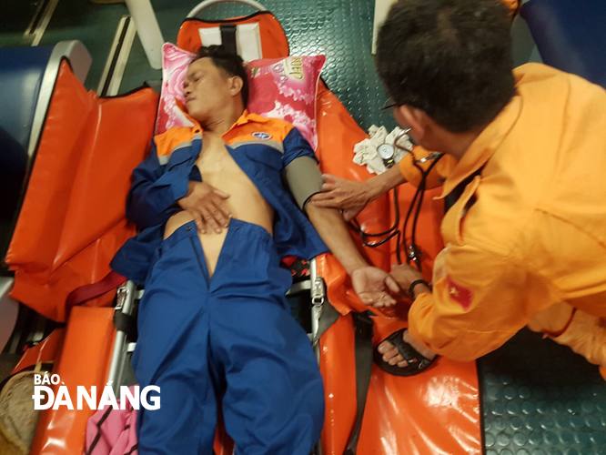 Giving initial first aid to the injured fisherman