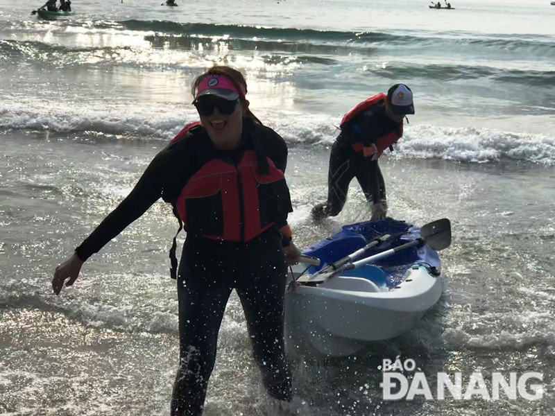 Female kayakers eagerly participating in the fascinating race