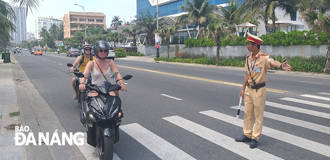 A traffic police officer pulling over a foreign driver for a surprise inspection