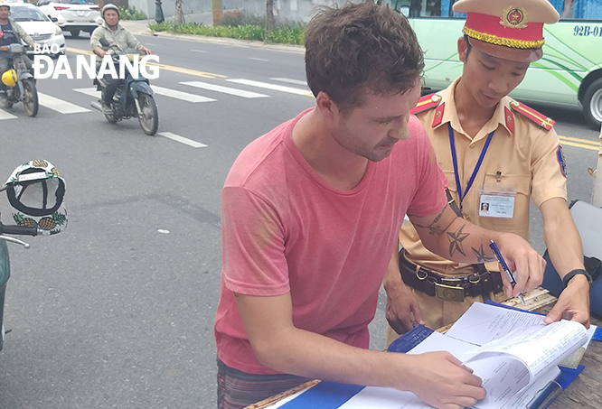 A foreigner receiving a traffic ticket for his offence