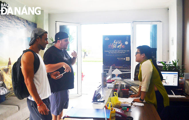 An employee from the tourist support centre giving free tourism information to foreigners