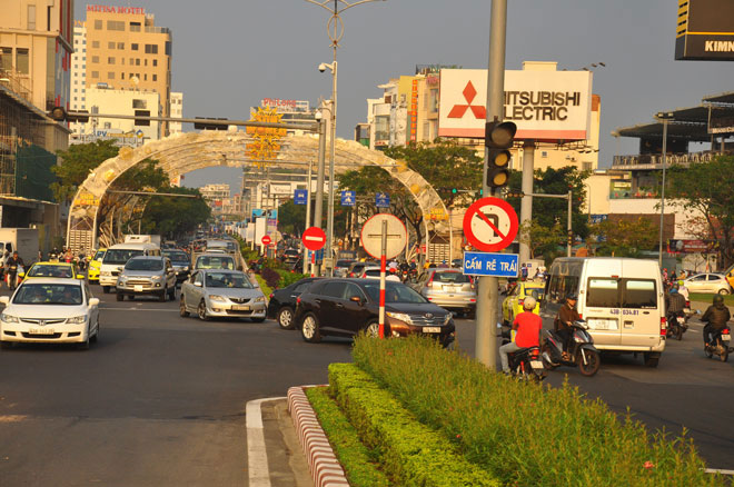 Traffic congestion seen at the western end of the Rong (Dragon) Bridge during rush hours