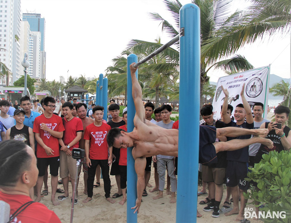 A young person performing hard Calisthenics exercises