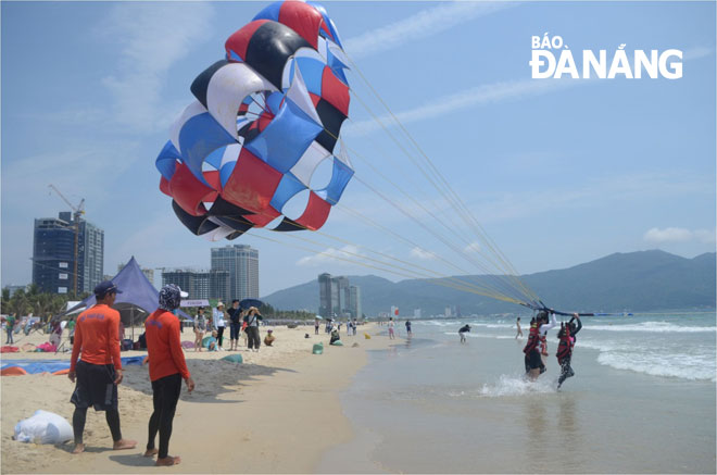Visitors experiencing parasailing on a local beach