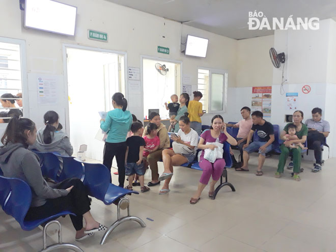 Parents with their children waiting for medical examinations at the Maternity and Paediatrics Hospital