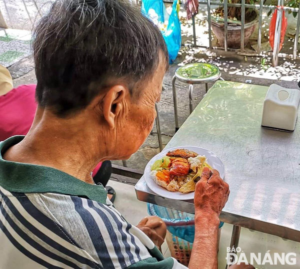 An elderly patient having free lunch at the hospital’s canteen