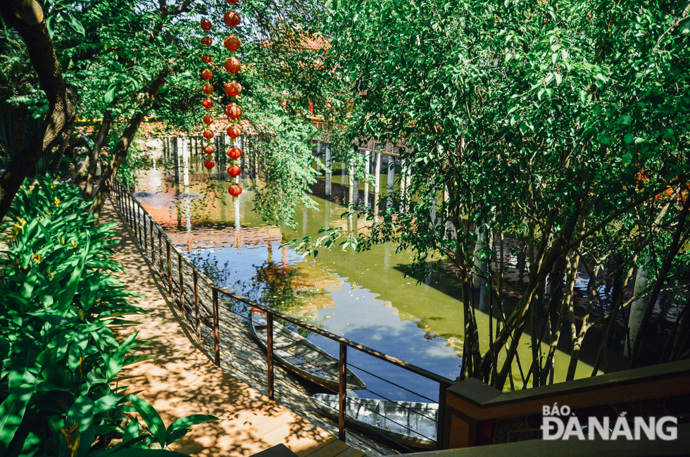 A shady, tree-lined street at the pagoda