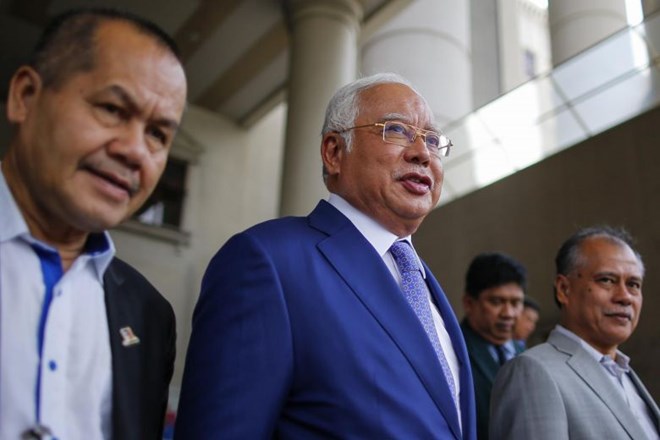 Najib (centre) is now facing dozens of charges for corruption, misappropriation of funds and abuse of power linked to the 1MDB.(Photo: EPA-EFE)