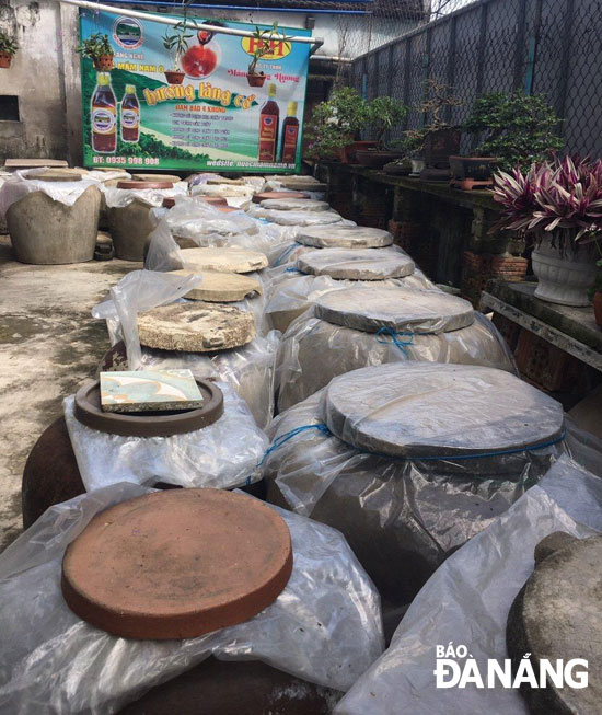 Vats of fish sauce at the Huong Lang Co production facility in Lien Chieu District’s Hoa Hiep Nam Ward