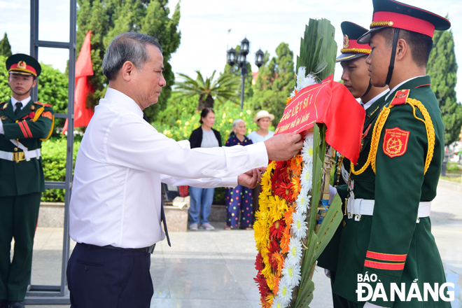 Secretary Nghia (in white shirt) at the 2 September Peace Monument