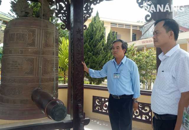 A newly-created bell tower at the Hoa Chau Commune martyrs’ cemetery