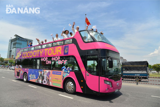 International chefs enjoying a city tour by a double-decker bus within the framework of the Da Nang International Food Festival 2019