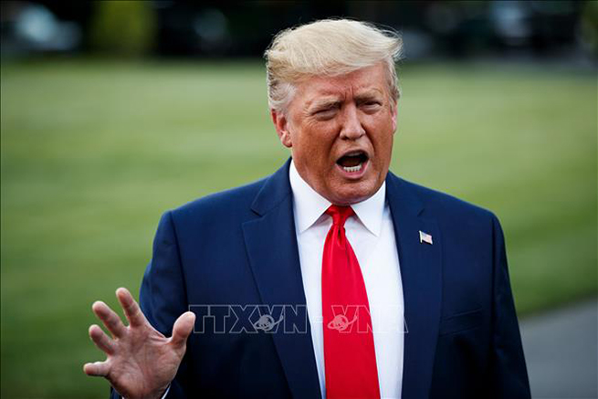 Tổng thống Trump thông báo áp thuế mới với hàng hóa Trung Quốc. Ảnh: AFP/TTXVN