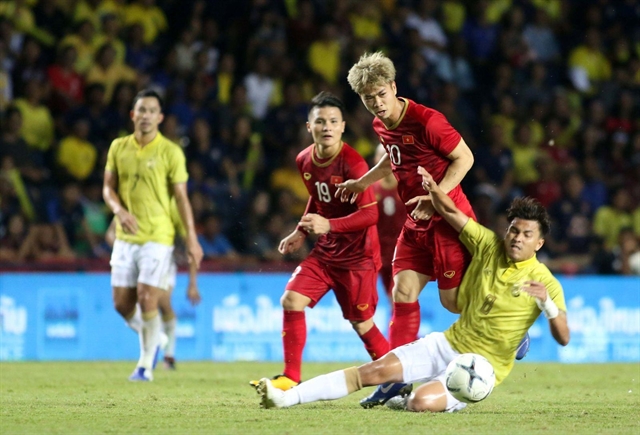 Việt Nam team (in red jersey) seen in a recent international event. They will face Thailand on September 5 in the Asian zone’s second qualifying round for the World Cup 2020. – Photo nld.vn Read more at http://vietnamnews.vn/sports/524264/vietnamese-ticket-allocation-for-thailand-match-sold-out.html#MUHWjQsHrouO2SBK.99