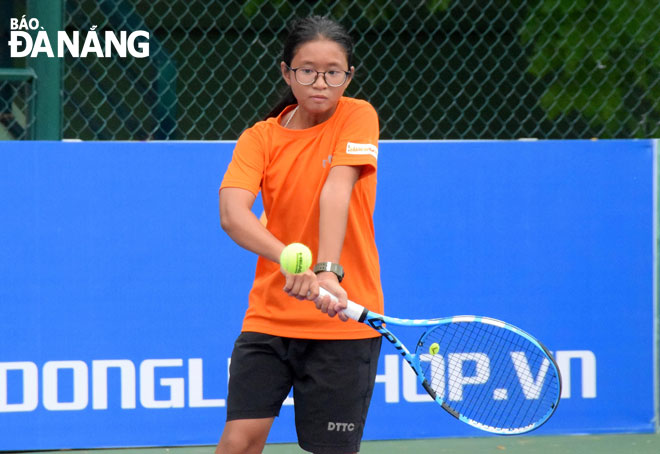 Local tennis player Ngo Bao Ngan, 12, is ranked 60th out of Asia's best 1.000 U14 players after one year of being trained at DTTC