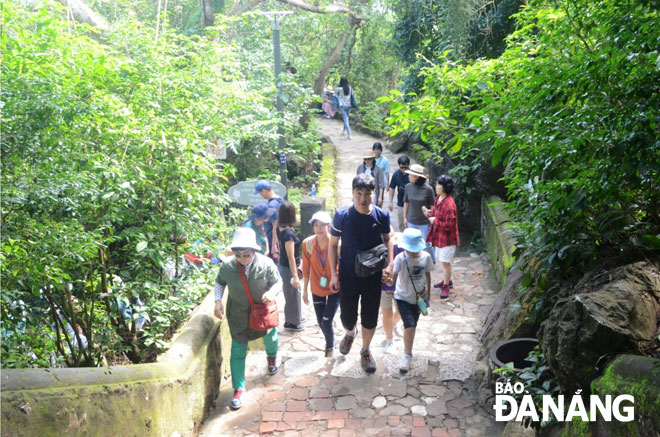 Popular attractions were crowded with holiday-makers from both home and abroad during the break. Visitors are pictured to queue to visit