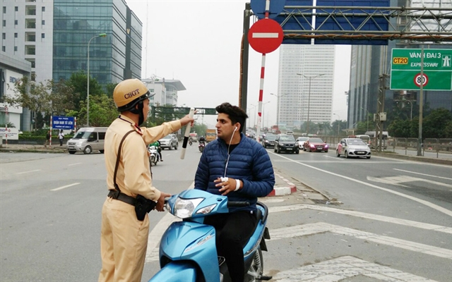 Information about traffic regulations will be disseminated among foreigners in an aim to reduce traffic accidents. — Photo: hanoimoi.com.vn