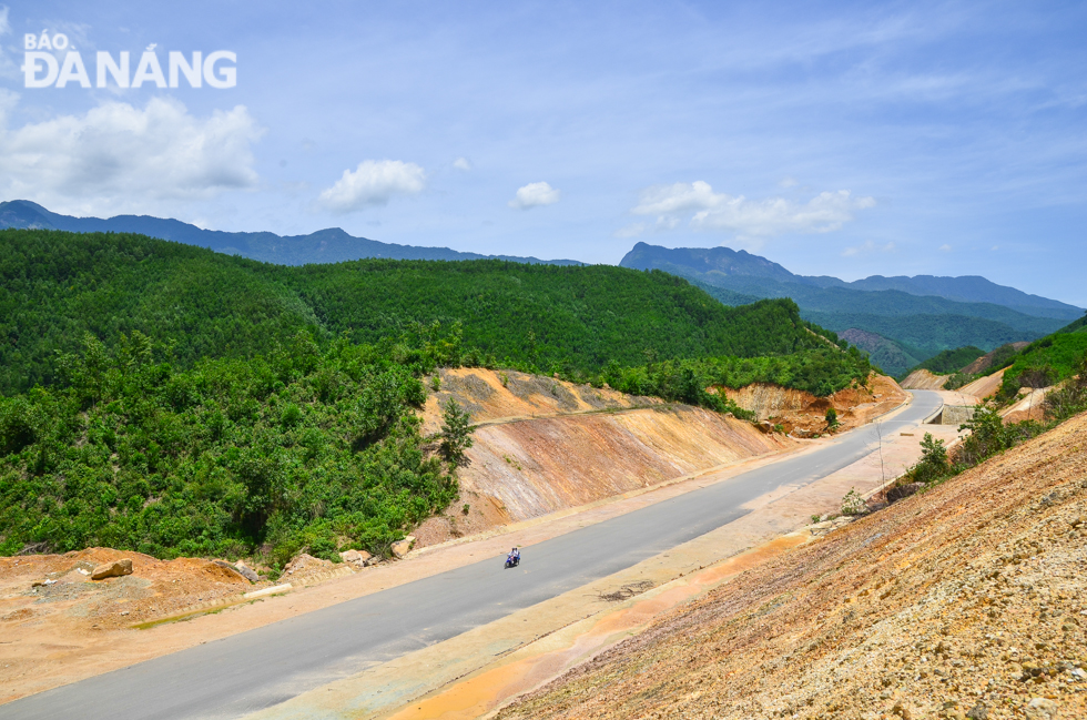 The highway winds through majestic mountains.