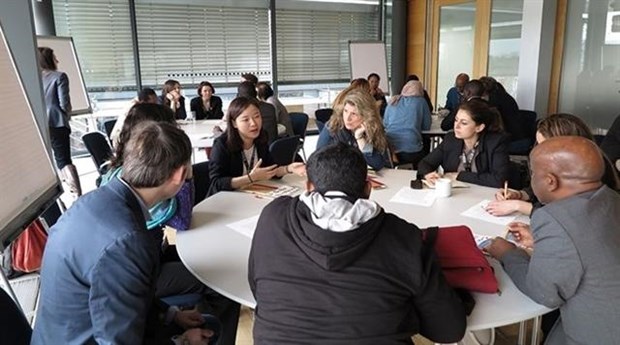 Nguyen Thi Anh Duong (third, left) discusses with her foreign fellows at an international seminar on sustainable development in Bonn, Germany, 2018. — Photo Courtesy of Ngyen Thi Anh Duong 