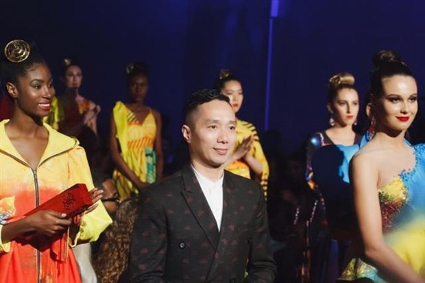 Do Trinh Hoai Nam is pictured with models presenting his collections at New York Couture Fashion Week 2019 (Photo: VNA)