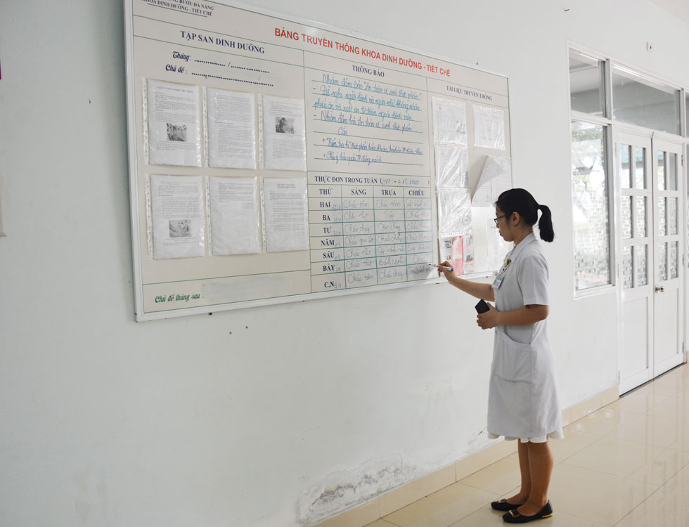 A leader of the Department of Nutrition – Abstinence writing next week’s menu on whiteboard