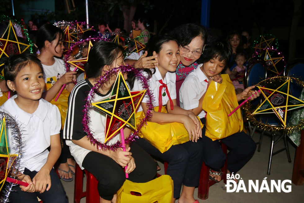 Children expressing their joy with Mid-autumn presents