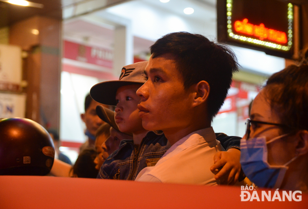 A child watching lion dance performances intently