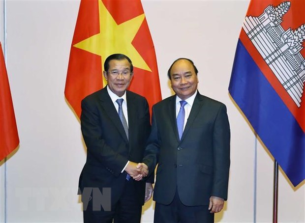 Thủ tướng Nguyễn Xuân Phúc và Thủ tướng Vương quốc Campuchia Samdech Techo Hun Sen sang dự Lễ Quốc tang nguyên Chủ tịch nước Lê Đức Anh. (Ảnh: Thống Nhất/TTXVN)