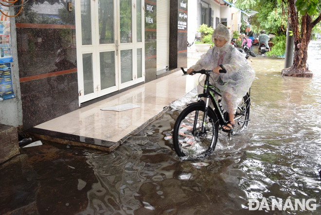 A large amount of rainwater spilling over pavements