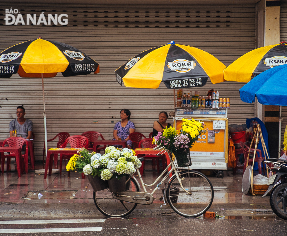 Selling flowers on a bike