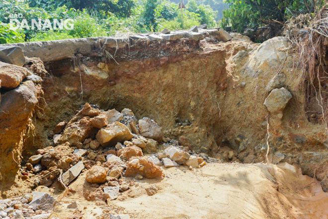 Landslides destroying a road