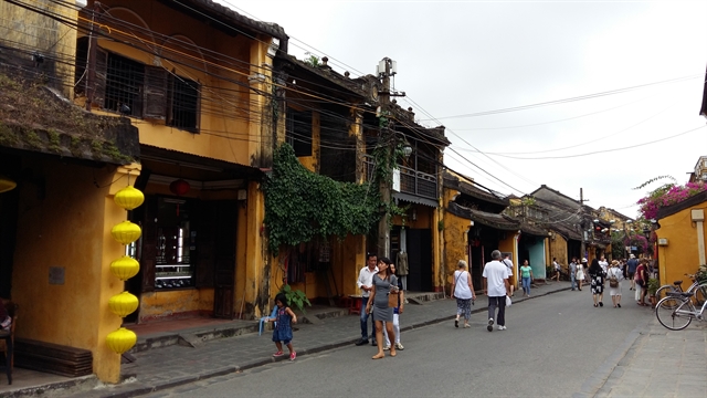 Trần Phú old street in Hội An is open free for tourists on December 4 to mark the 15th anniversary of Việt Nam Heritage Day. — VNS Photo Công Thành  Read more at http://vietnamnews.vn/life-style/548820/cultural-activities-to-celebrate-heritage-day.html#CAJkrmesYOb3iGm4.99